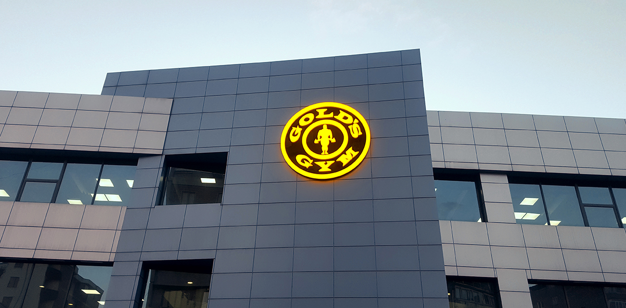 Gold's Gym illuminated branding for boosting business visibility