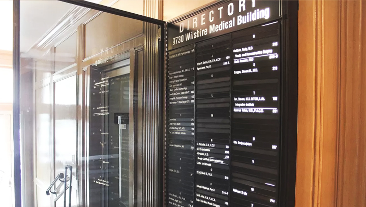 Interior office directory sign displaying business services for advertising