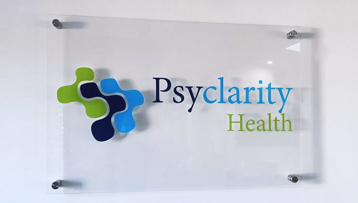 Psyclarity Health plastic office sign displaying the company name and logo made of acrylic