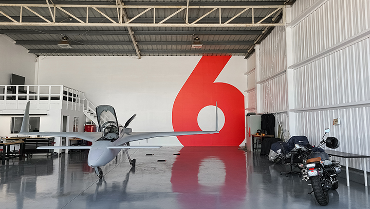 Airplane Hangar custom wall decal in red displaying the number 6 made of opaque vinyl