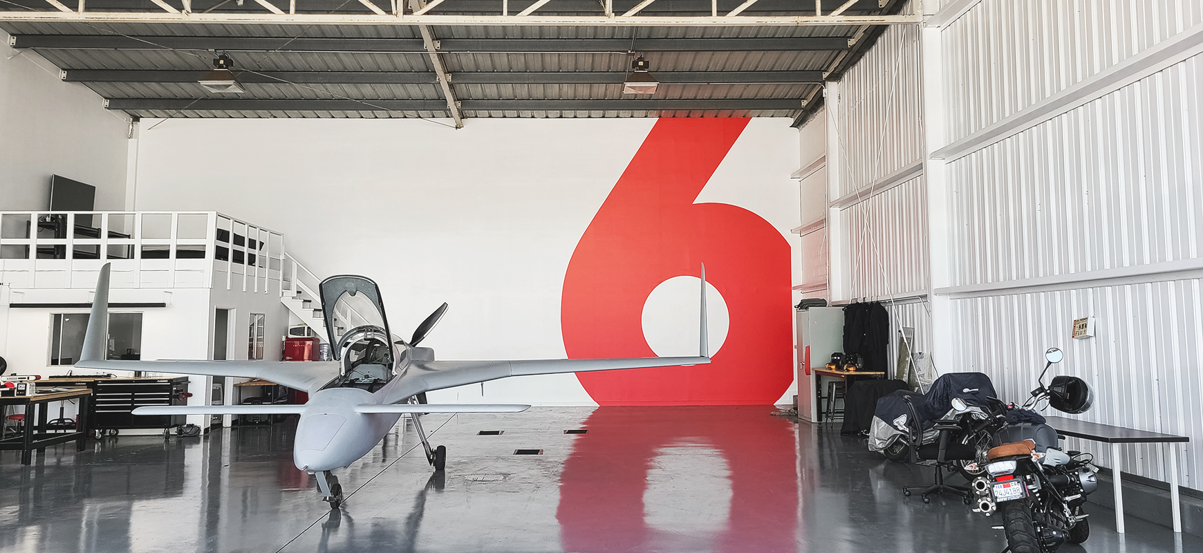 Airplane Hangar custom vinyl decal in red displaying the number six made of opaque vinyl