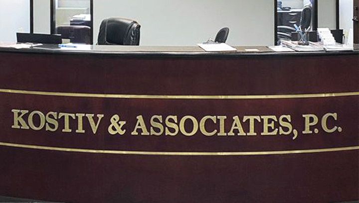 Kostiv & Associates office backlit foam core sign made of ultra board for reception branding