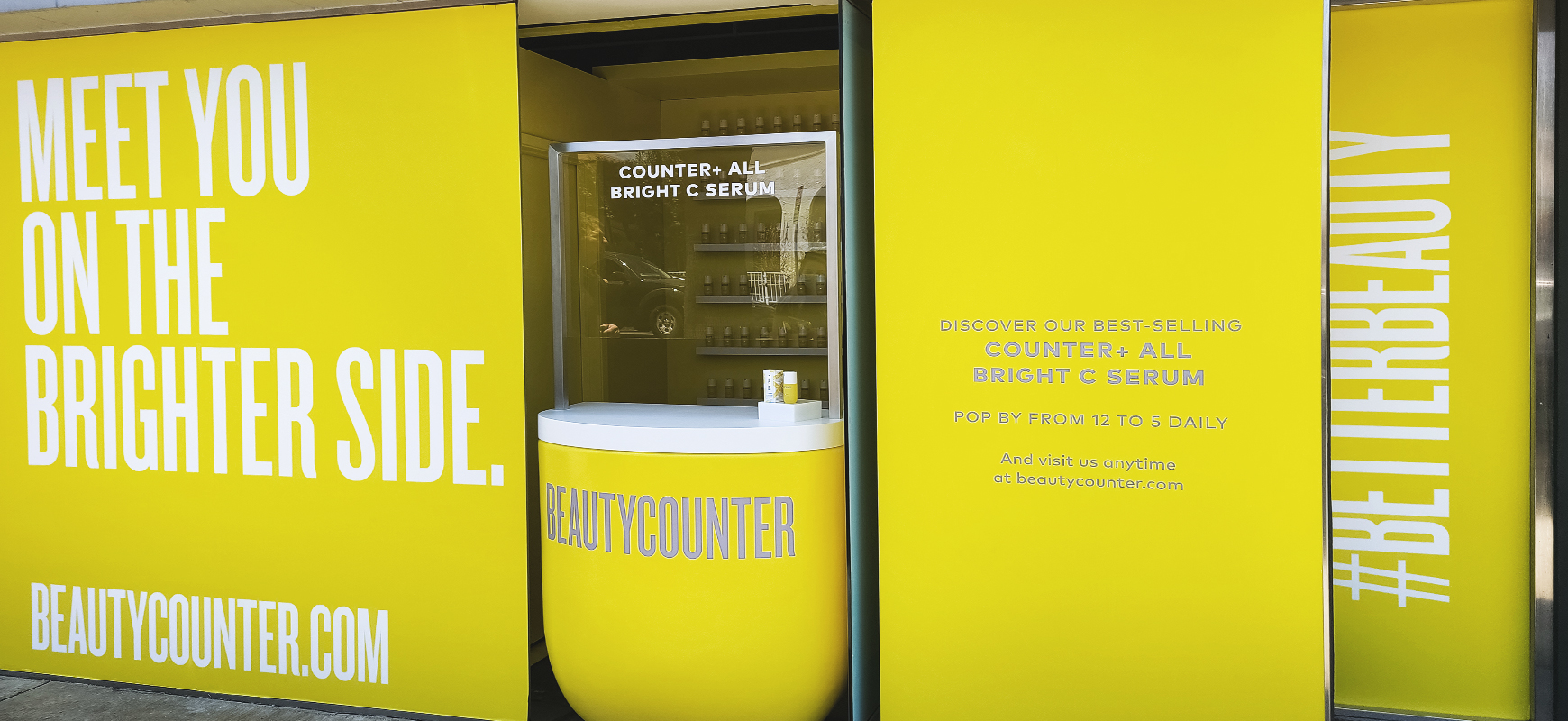 Beauty Counter custom decals in yellow made of opaque vinyl for storefront window branding