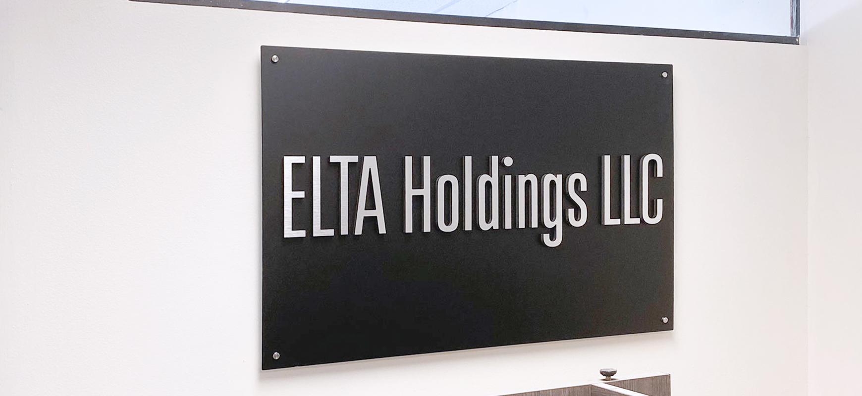 Elta Holdings LLC foam core sign with brushed brand name 3d letters made of ultra board