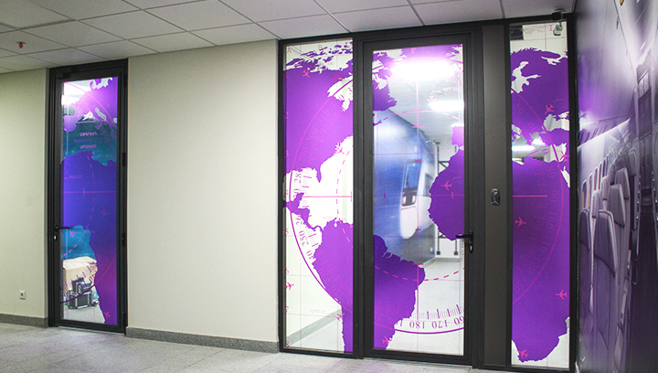 Ameriabank decorative window signs in purple displaying the world map made of clear vinyl
