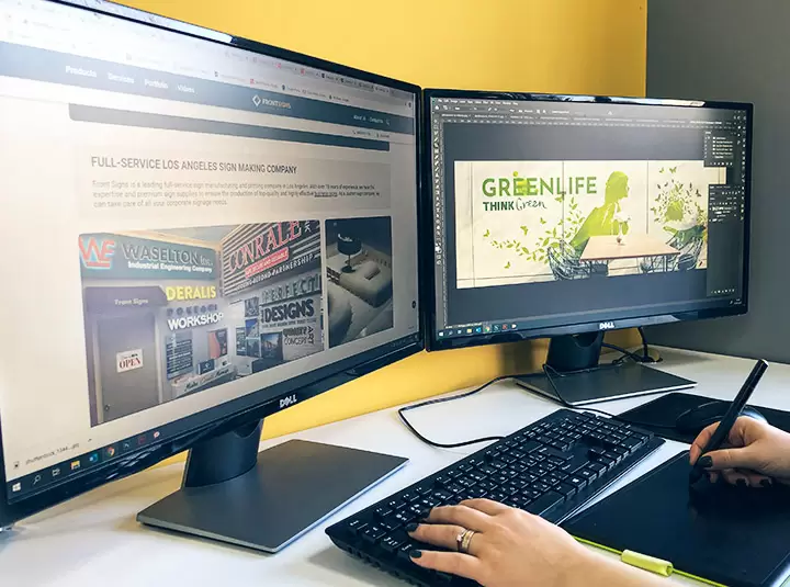 Designing lobby signs for a client with a graphics tablet
