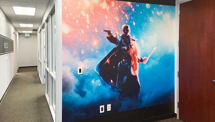 Ecco Studios lobby wall graphics displaying a video game character made of opaque vinyl