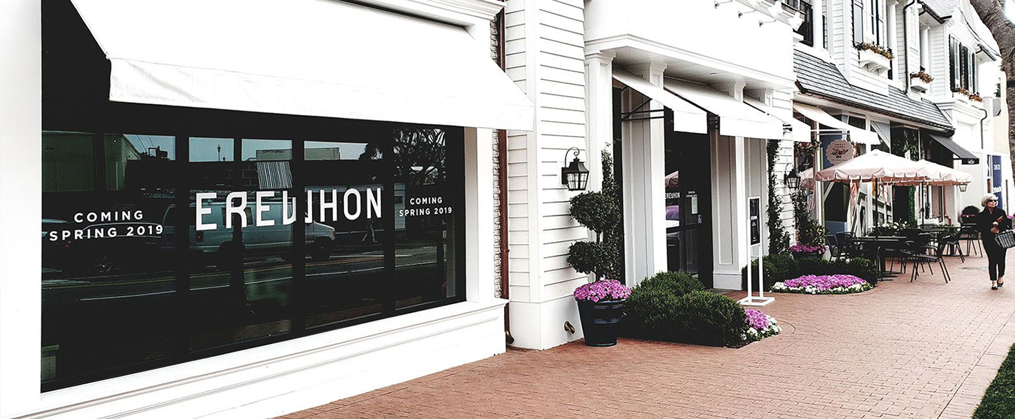 Erewhon window signs in white made of opaque vinyl for exterior branding