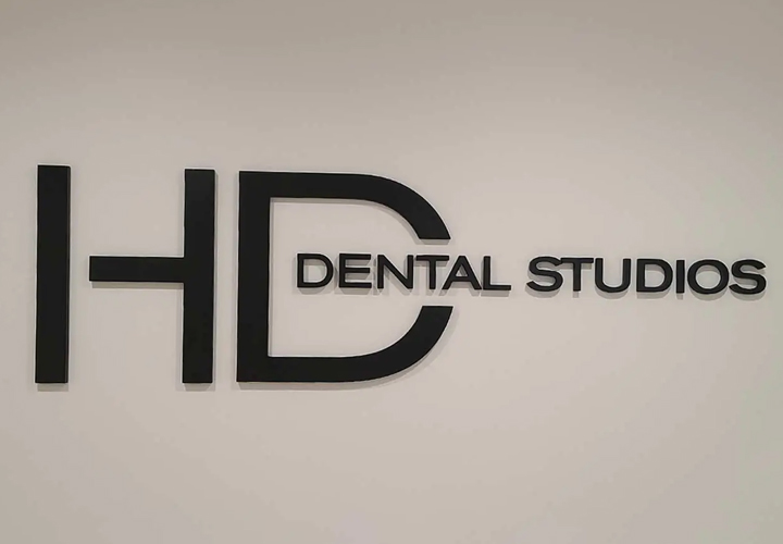 HD Dental Studios foam core sign displaying the brand name for interior design