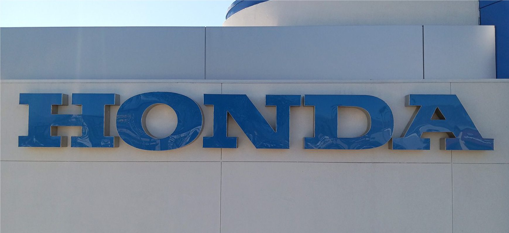 Honda commercial sign repair of the blue storefront brand name made of acrylic and aluminum