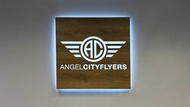 Lobby signs for Aero City group featuring illumination and engraved in wooden vinyl veneer