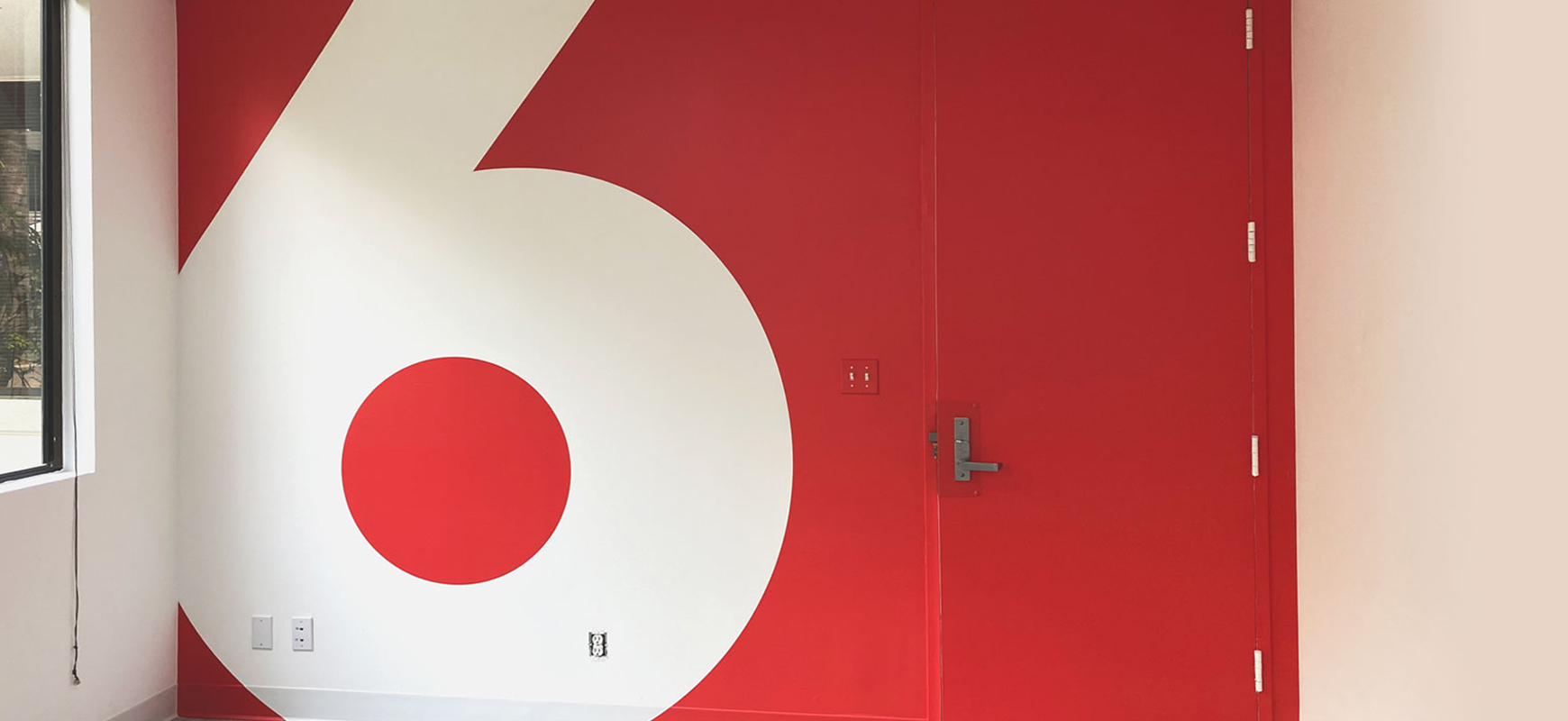 red and white vinyl wall decal with the number 6 made of opaque vinyl for interior design