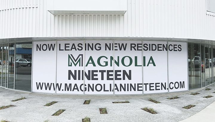 Magnolia Nineteen informational window sign in white made of opaque vinyl