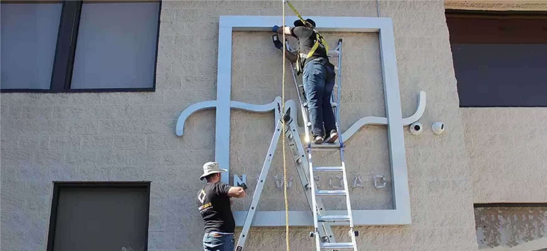 New Road commercial sign repair of an outdoor business display made of aluminum for branding