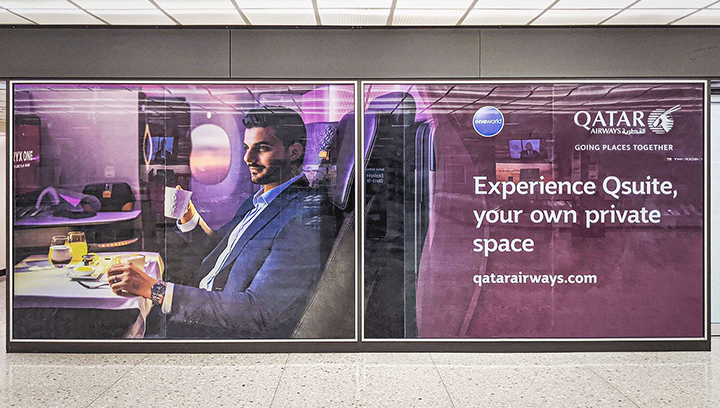 Qatar Airways promotional wall wraps displaying the brand name and logo made of opaque vinyl