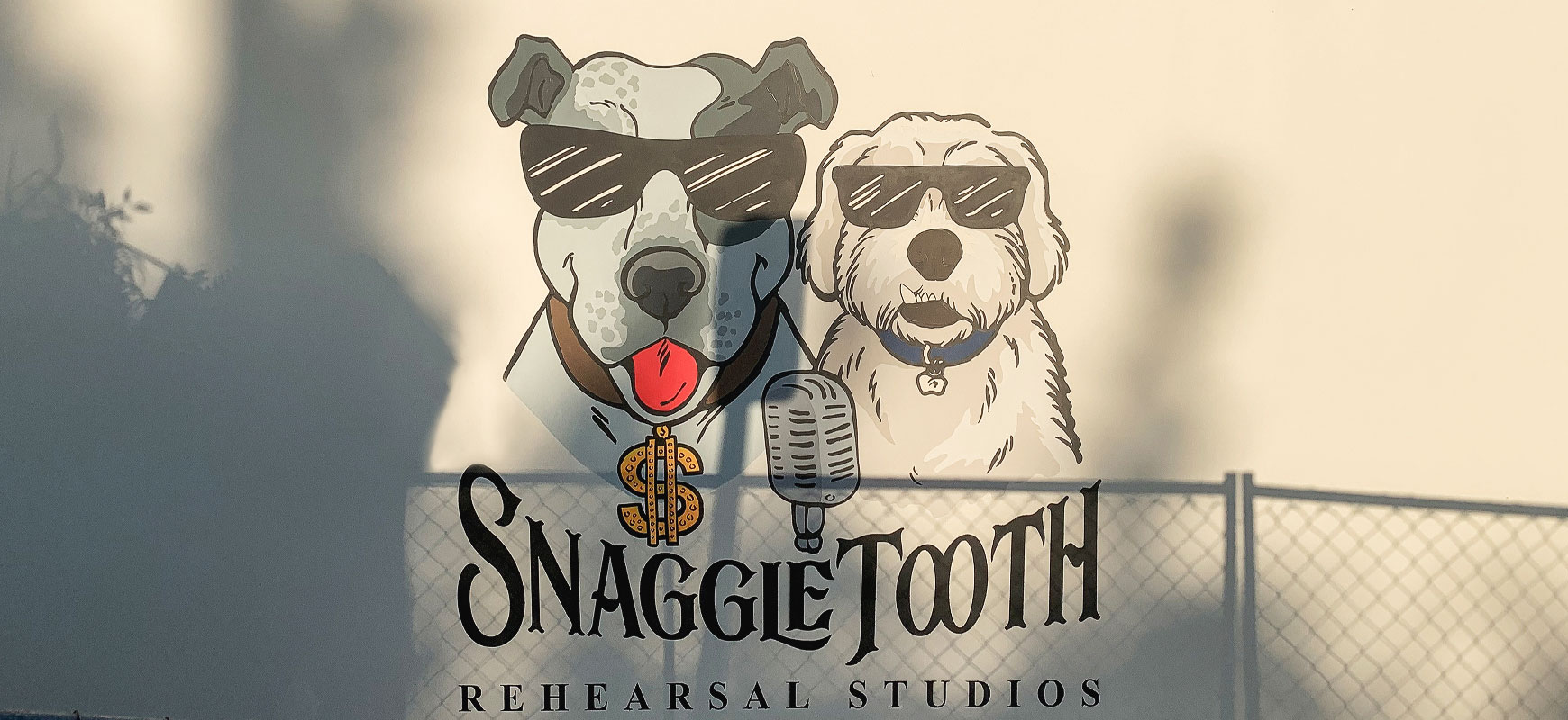 Snaggle Tooth outdoor wall decal displaying the company name and logo made of opaque vinyl