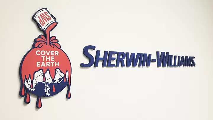 Notable lobby signs for Sherwin Williams featuring their company name and logo
