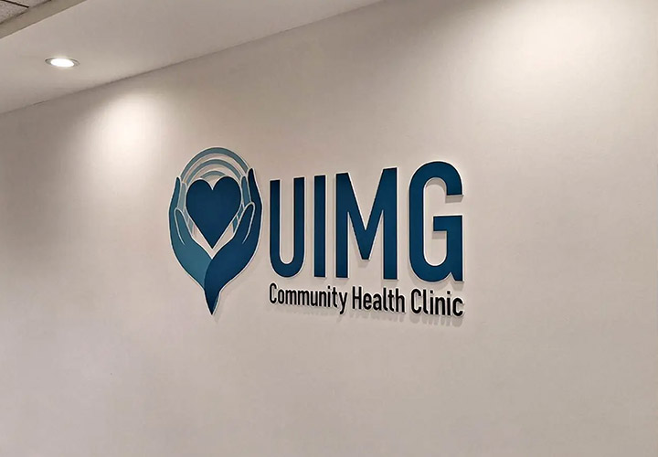 UIMG foam logo cutout displaying the brand name and hands holding a heart for interior design