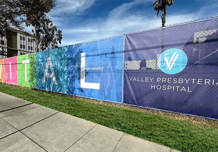 Valley Presbyterian Hospital large format printing on a mesh banner with colorful brand imagery