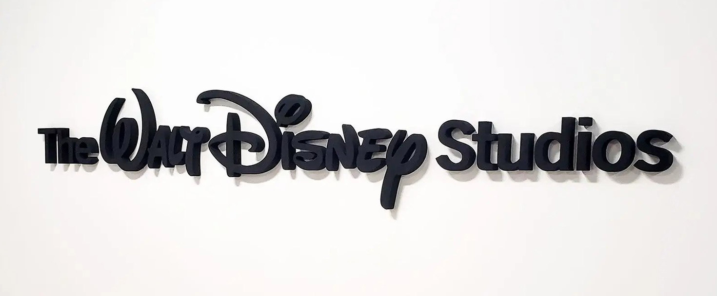 Walt Disney Studios foam core sign in black spelling out the company name for interior branding