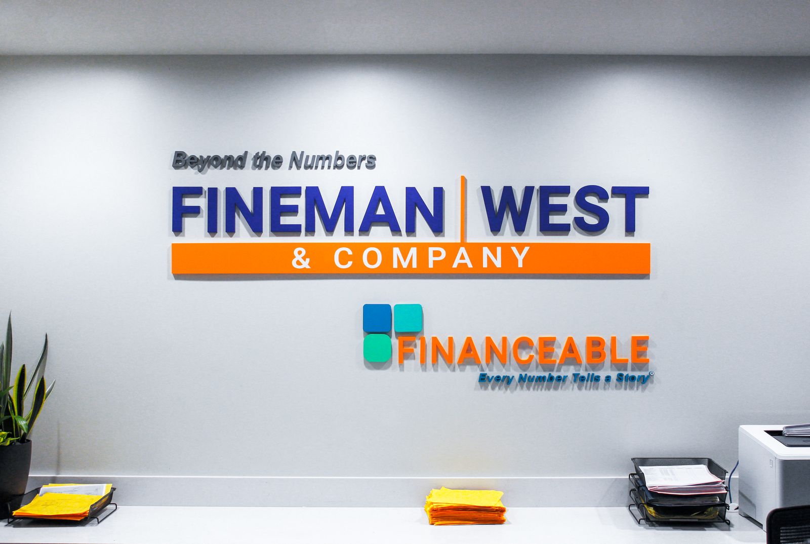 Fineman West & Company office lobby sign made of acrylic for interior branding