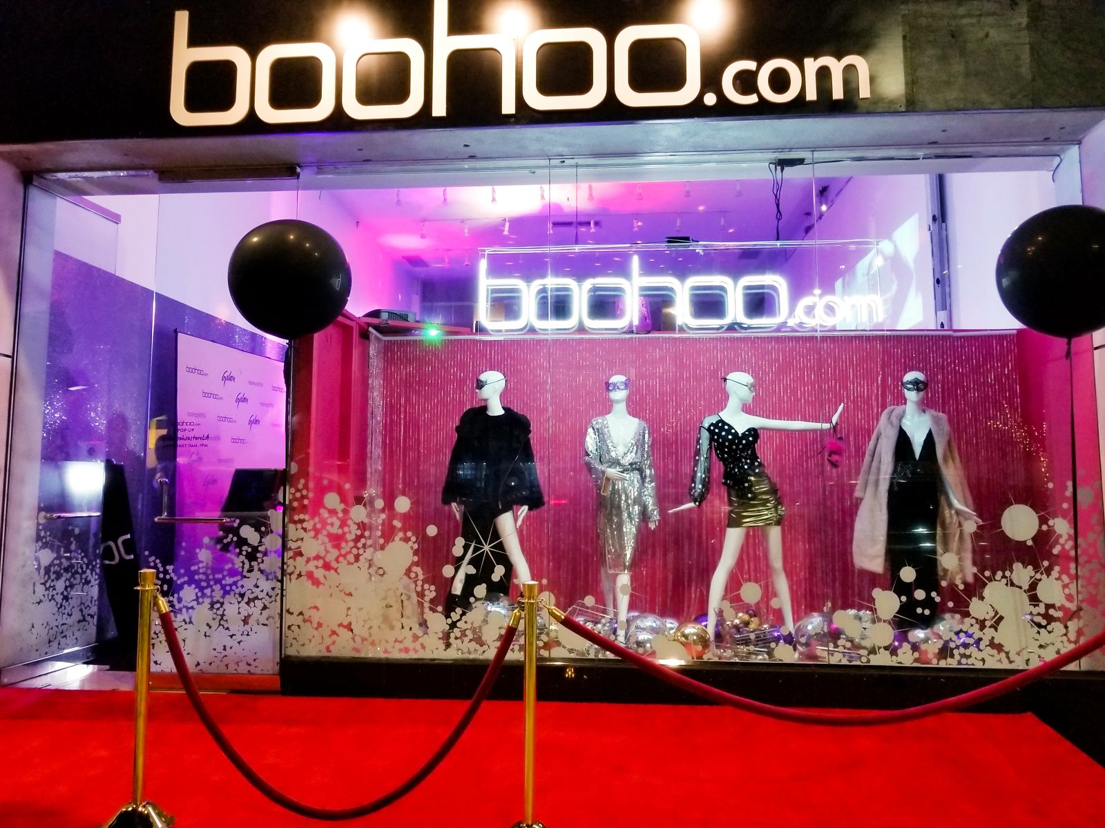 Boohoo 3d sign on a black background made of acrylic and aluminum for store branding