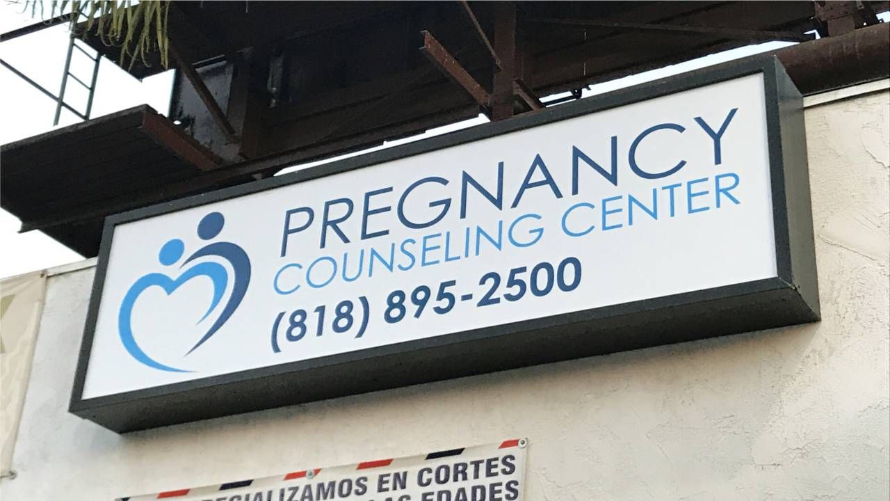 Pregnancy Counseling Center LED light box with promotional info made of aluminum and Lexan