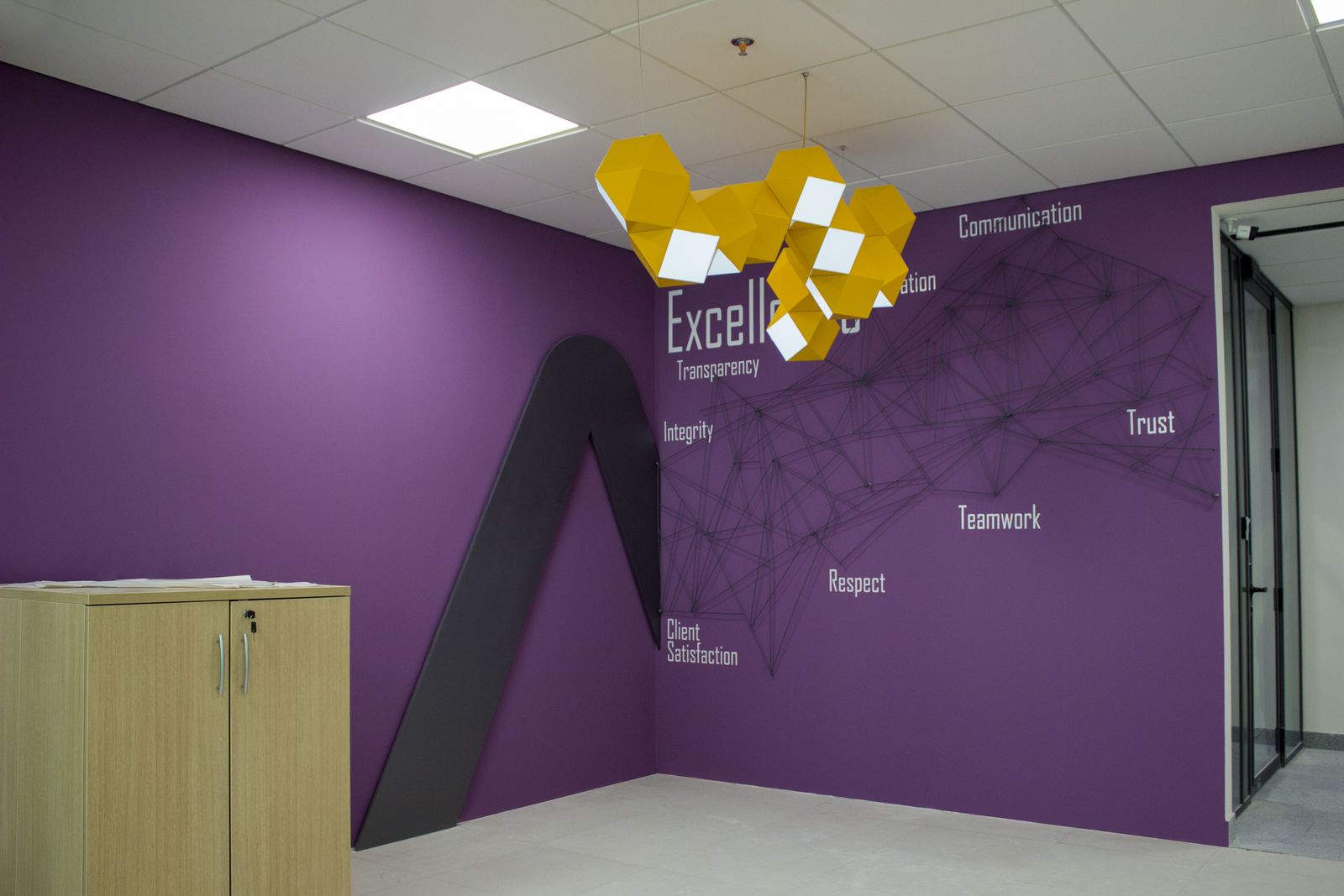 Ameriabank custom indoor hanging sign in a decorative chandelier style made of PVC and acrylic