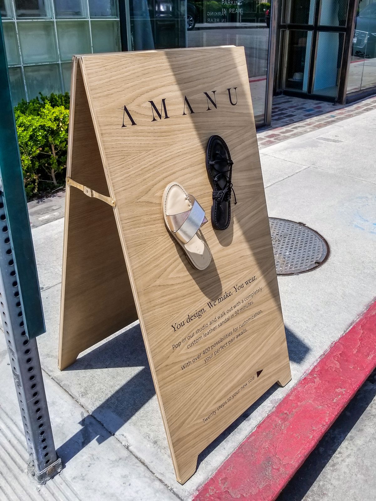 Wooden outdoor sandwich board for the Amanu | Front Signs