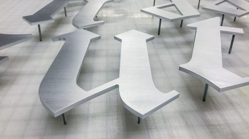 brushed aluminum letters sign