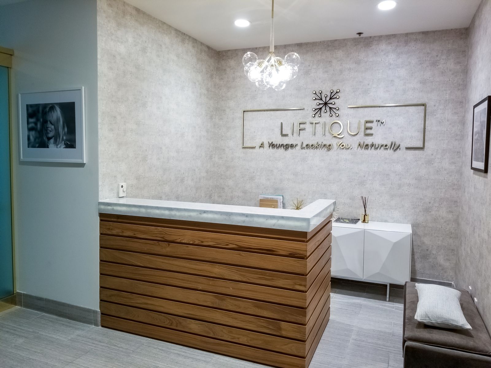 Liftique Clinic reception logo sign and slogan made of aluminum and acrylic