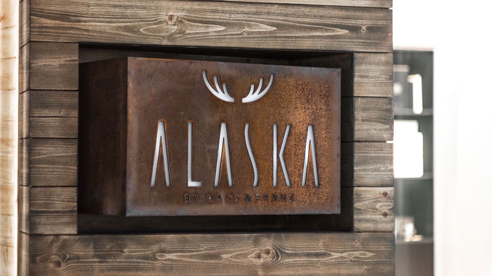 Alaska by Hans and Franz custom interior logo sign made of aluminum and acrylic for branding