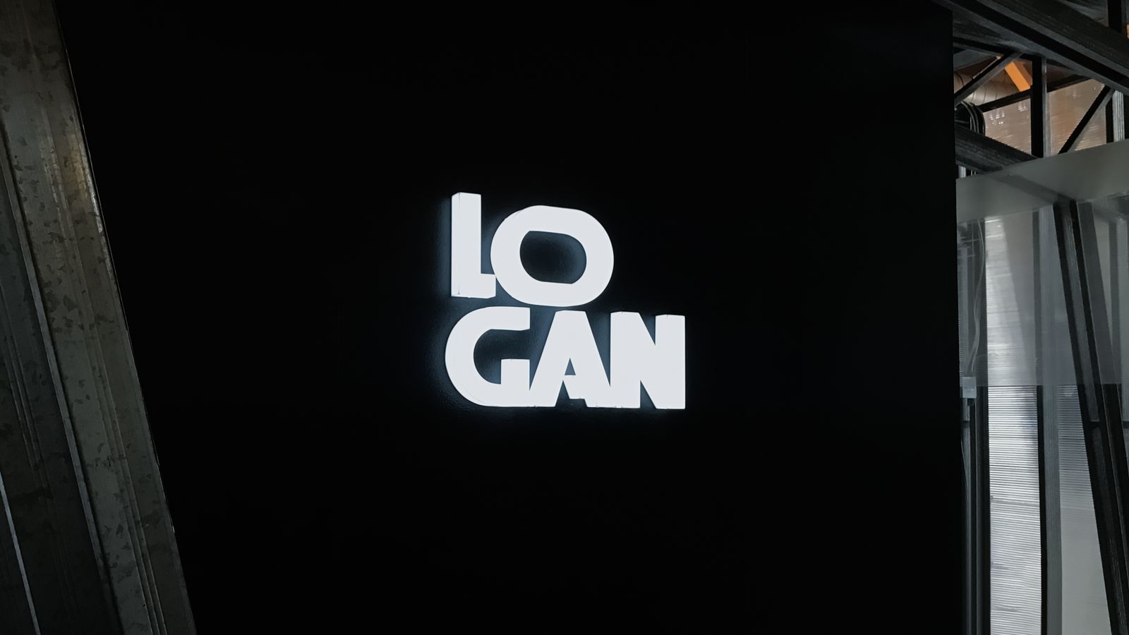Logan illuminated interior signage displaying the company name made of acrylic for branding
