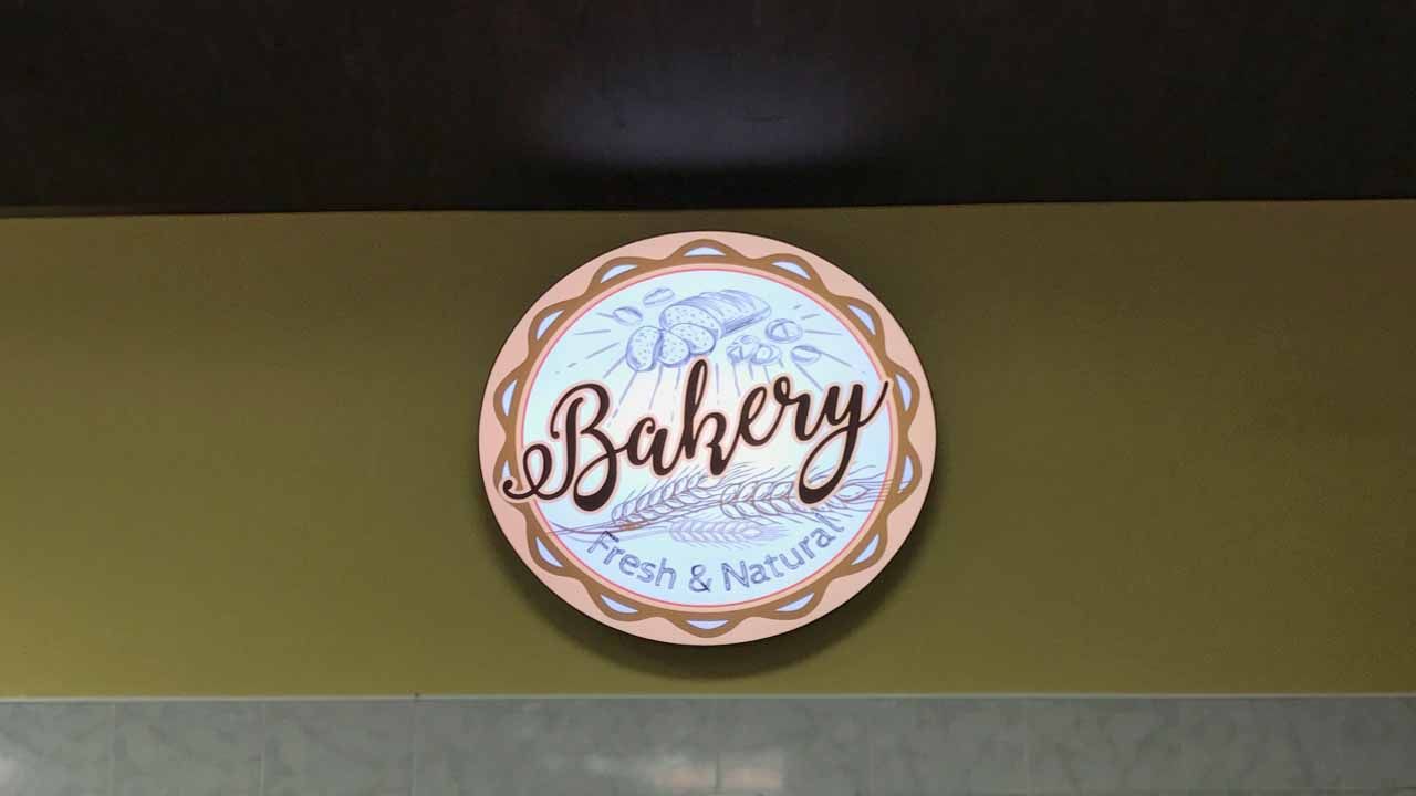 Bakery interior LED light box with graphics made of aluminum, acrylic and backlit vinyl