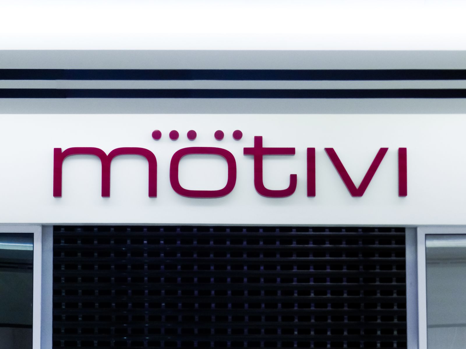 Motivi 3d sign in red with the company name and logo made of acrylic and aluminum for branding