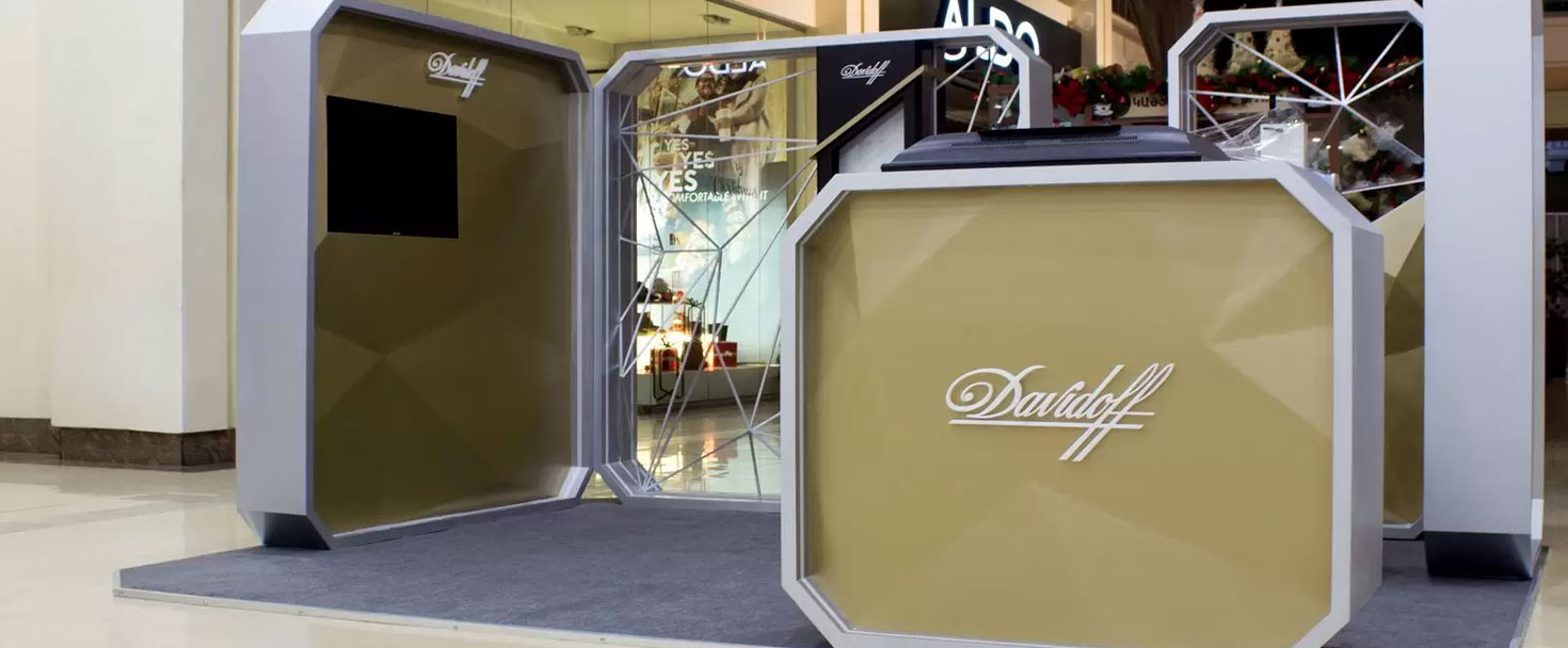 Davidoff trade show displays with white brand name letters made of wood, acrylic, and aluminum