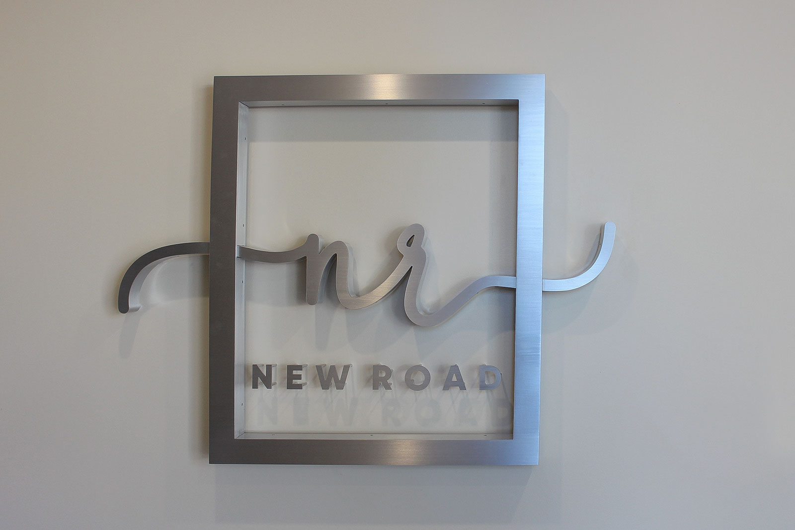 brushed aluminum office sign