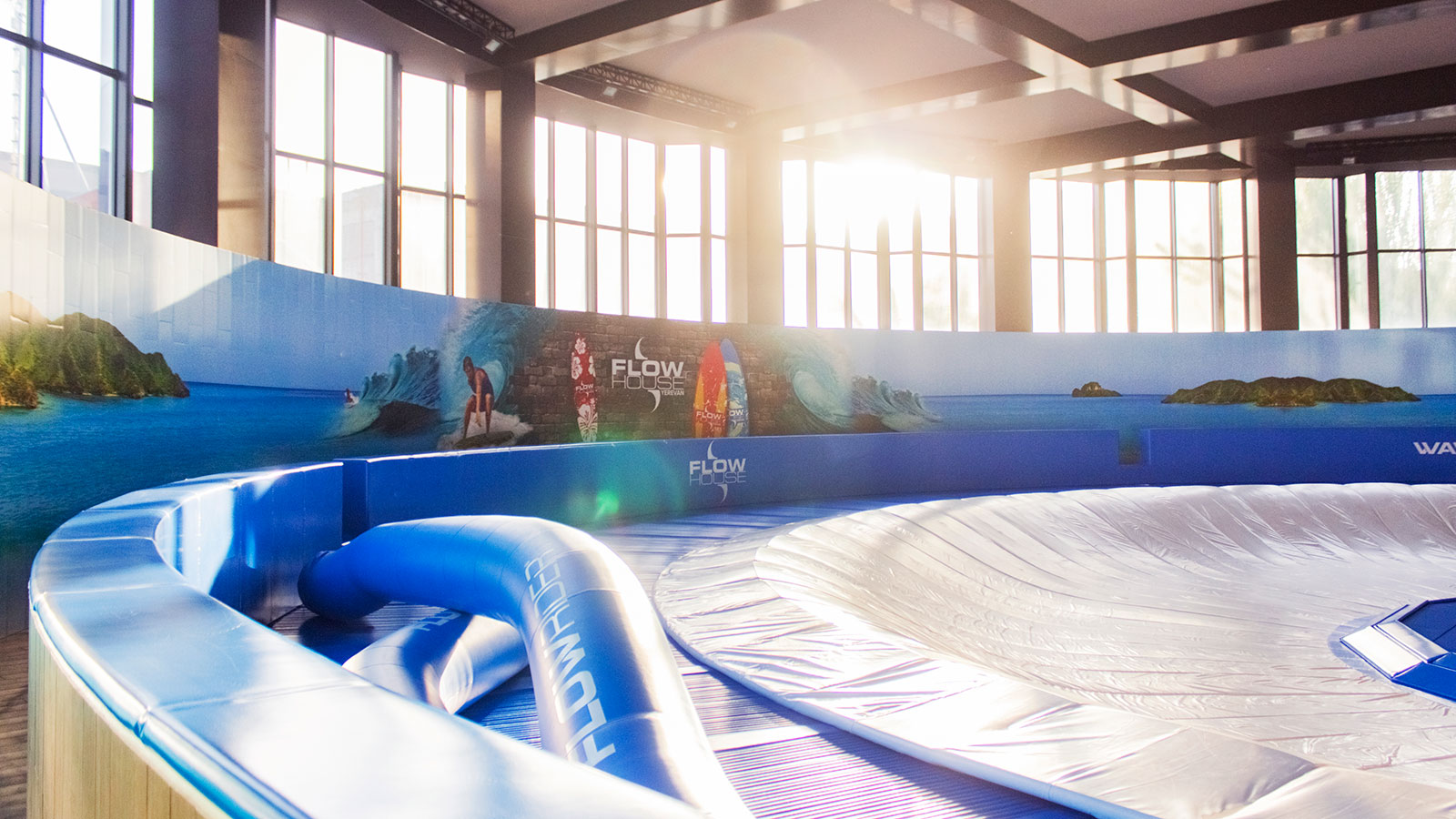 Flow House custom interior wall sign with surf graphics made of opaque vinyl for full branding