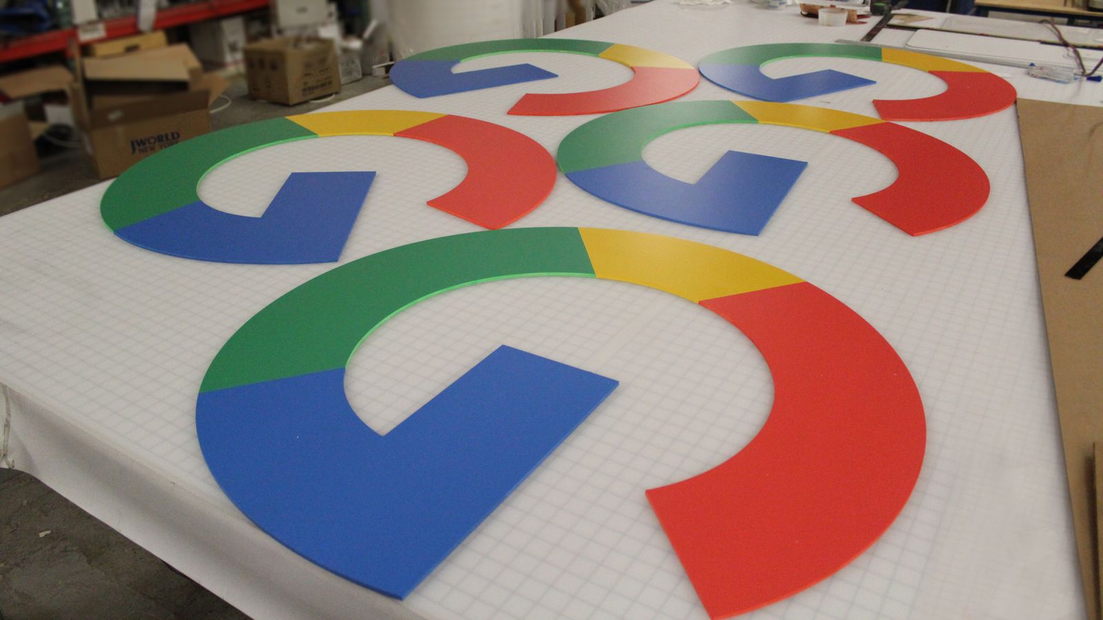 Google 3d plastic logo signs in bright branded colors made of PVC displayed on the table