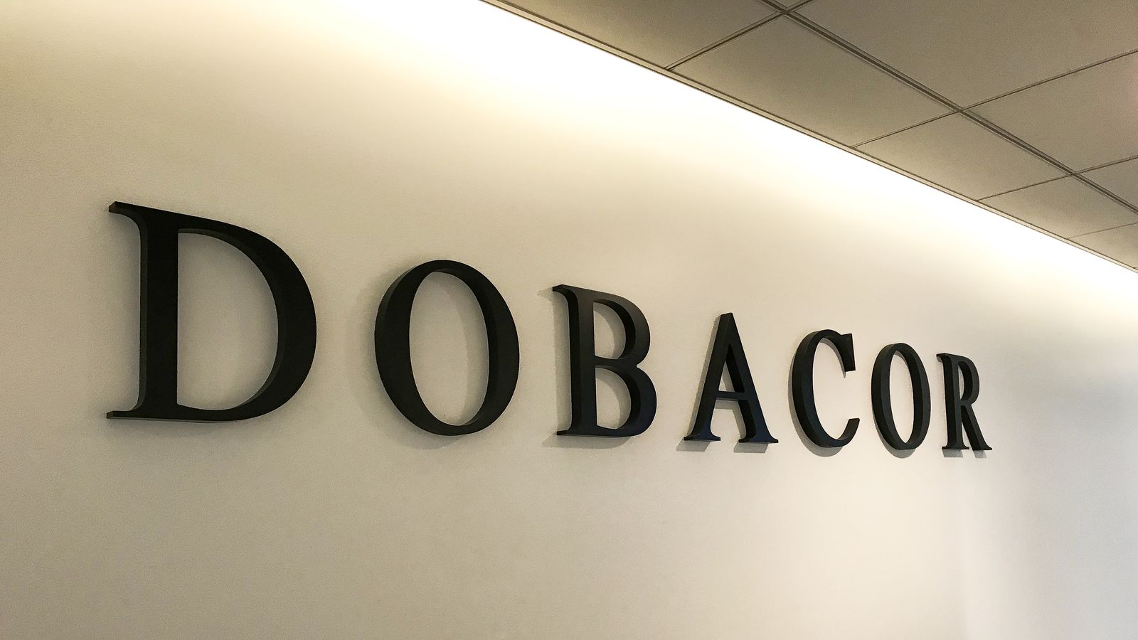 Dobacor 3d office sign in black color displaying the company name made of acrylic