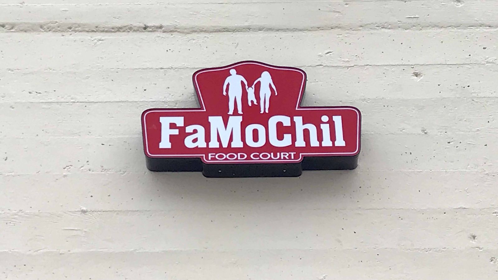 Famochil light box sign with a custom shape made of acrylic and aluminum for brand visibility