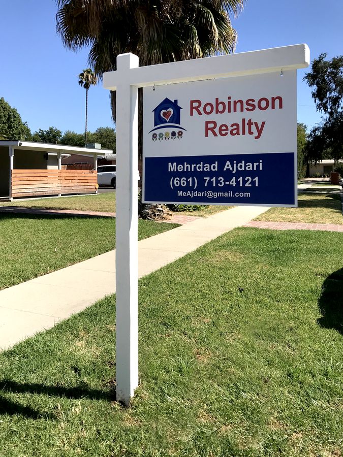 hanging real estate sign