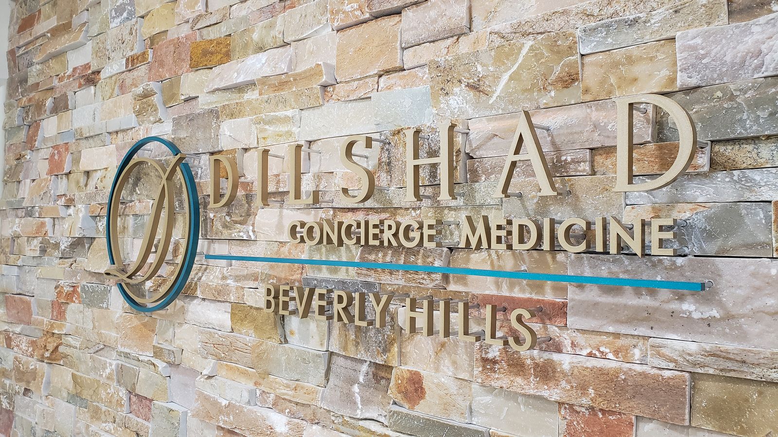 Dilshad Concierge Medicine 3d office sign painted in gold and blue colors made of acrylic