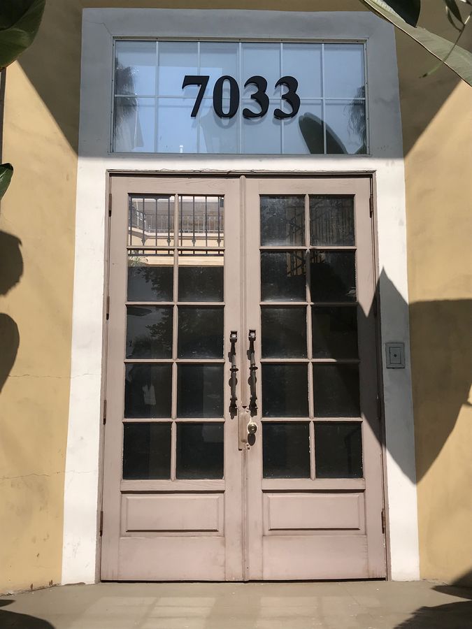 3d plastic sign with 7033 number painted in black made of PVC for displaying a home address