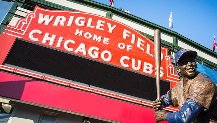 custom baseball field signage with a player statue displayed at the entrance