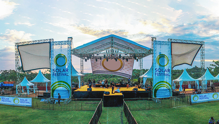 Solar Festival signs in blue displaying branded graphics outdoors