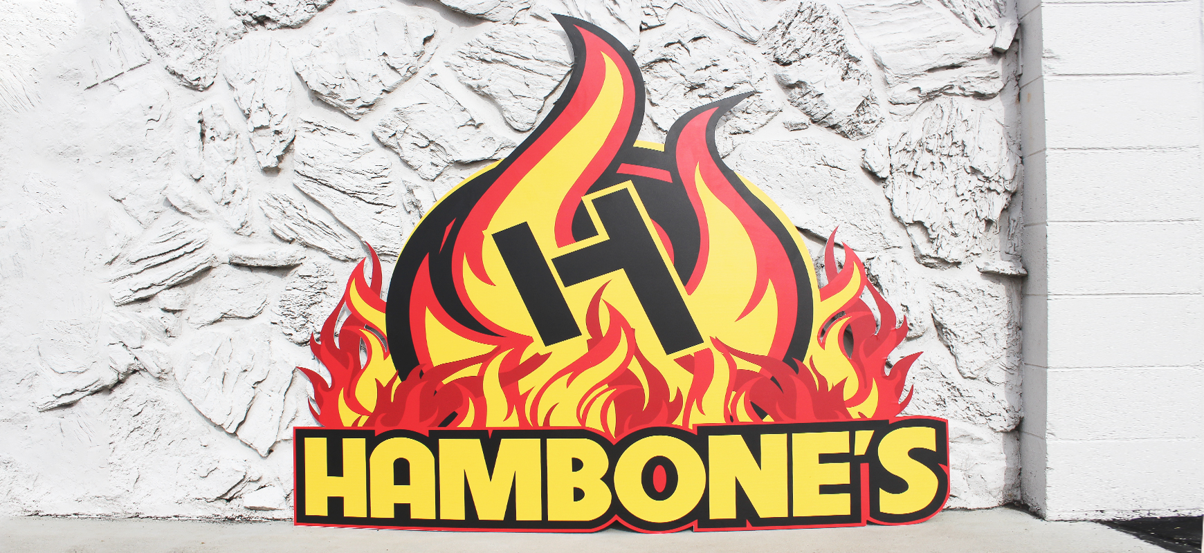 Hambone custom event signs with the brand name and fire logo made of opaque vinyl and PVC