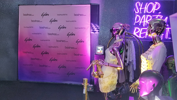 Boohoo event sign displayed as a freestanding photoshoot backdrop made of vinyl