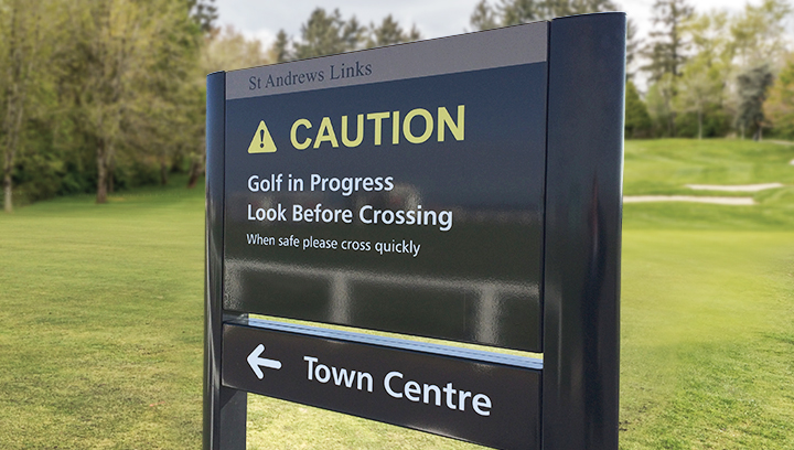 black golf event signage displaying warning and directional messages