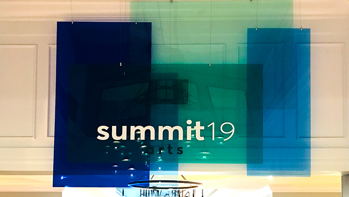 Summit 19 event signs in a hanging style made of blue and green acrylic